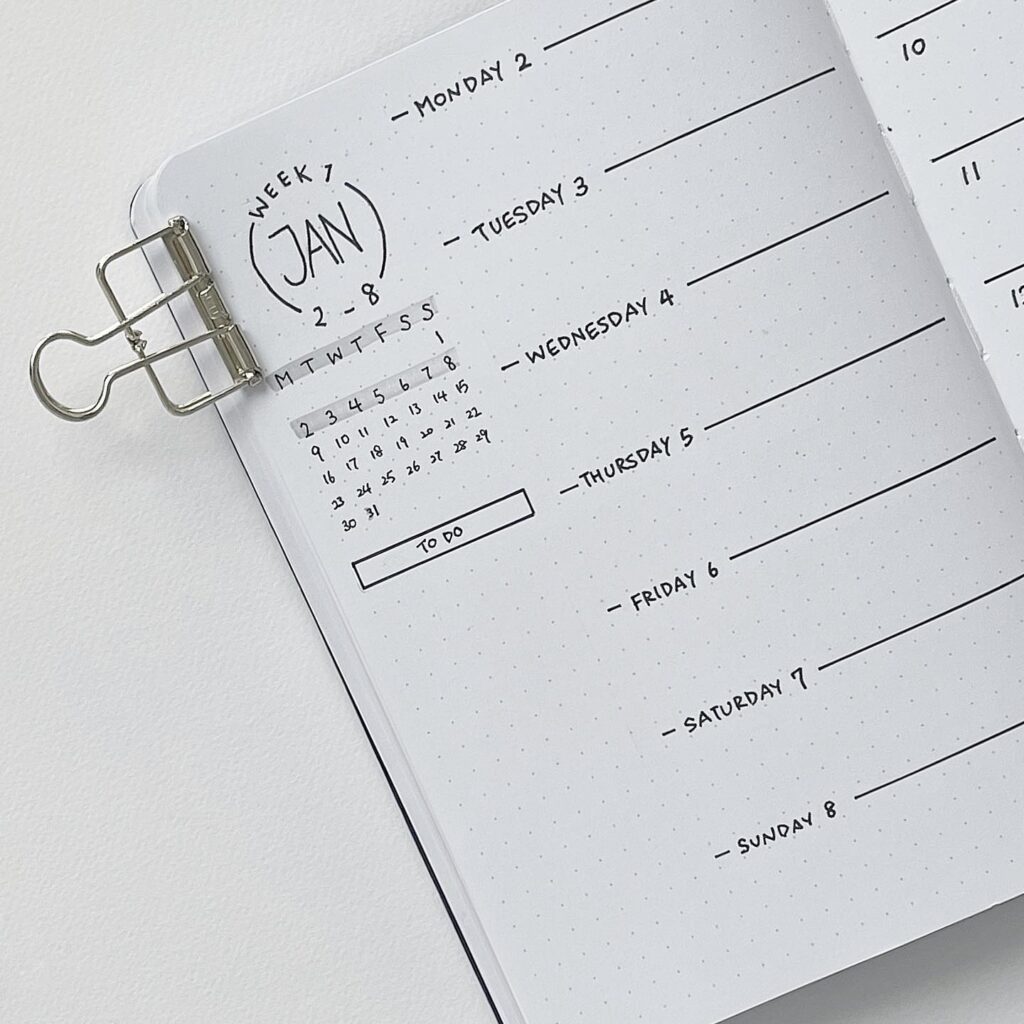 Open planner showing a weekly layout for early January, with a mini calendar and to-do list section.