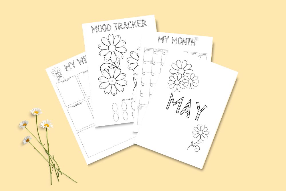 Printable May Bullet journal with mood tracker and calendar pages on yellow background, featuring flower designs.