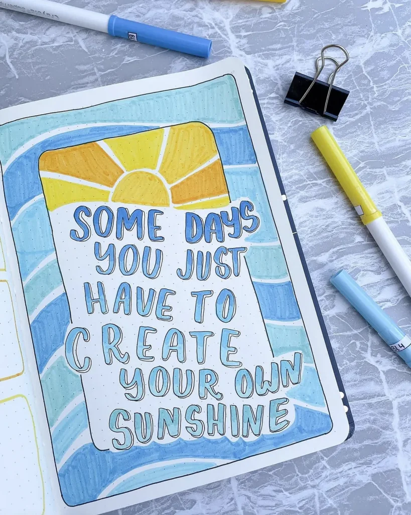Hand-drawn motivational quote: Some days you just have to create your own sunshine in a colorful notebook.
