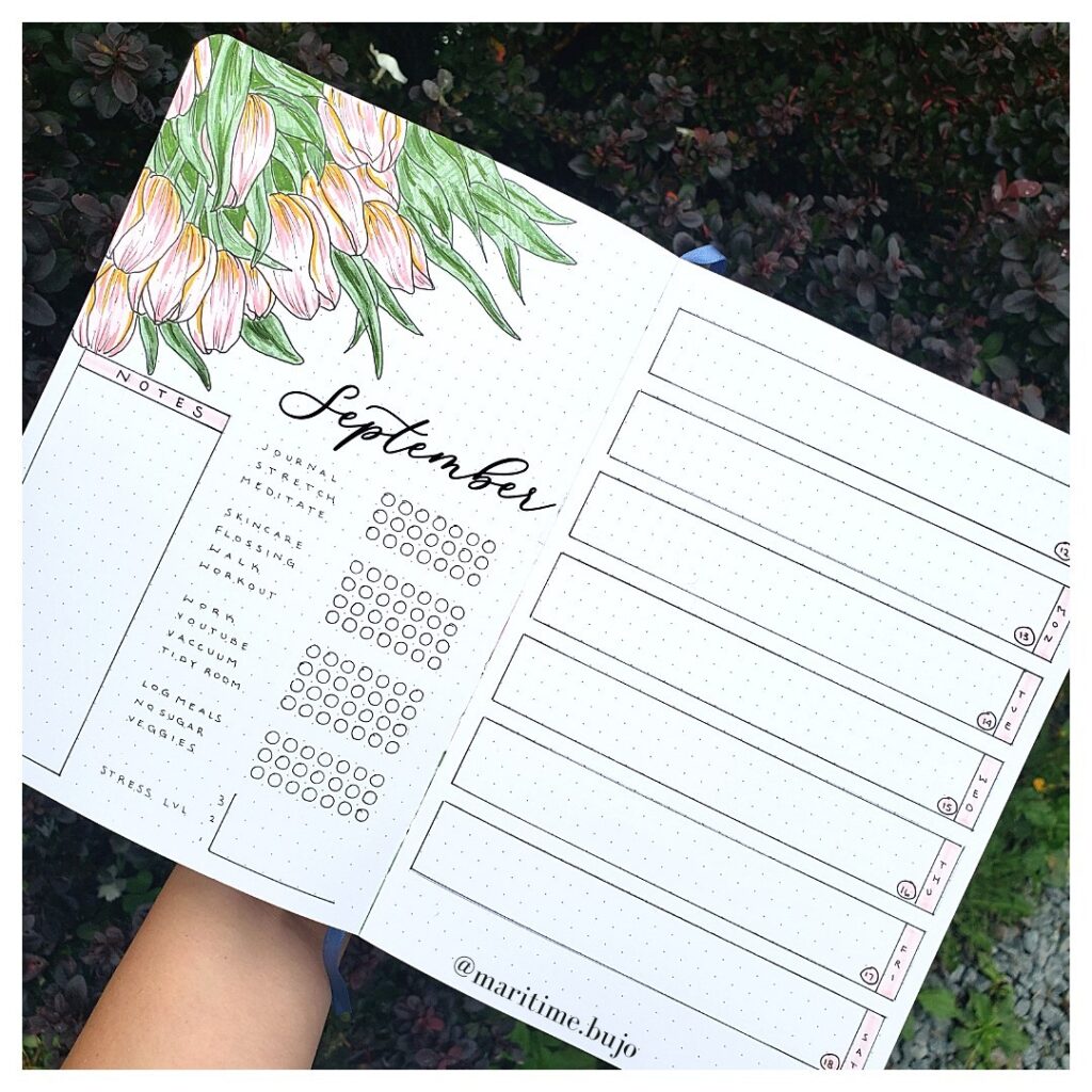 September bullet journal layout with floral design, featuring notes and weekly planner sections.