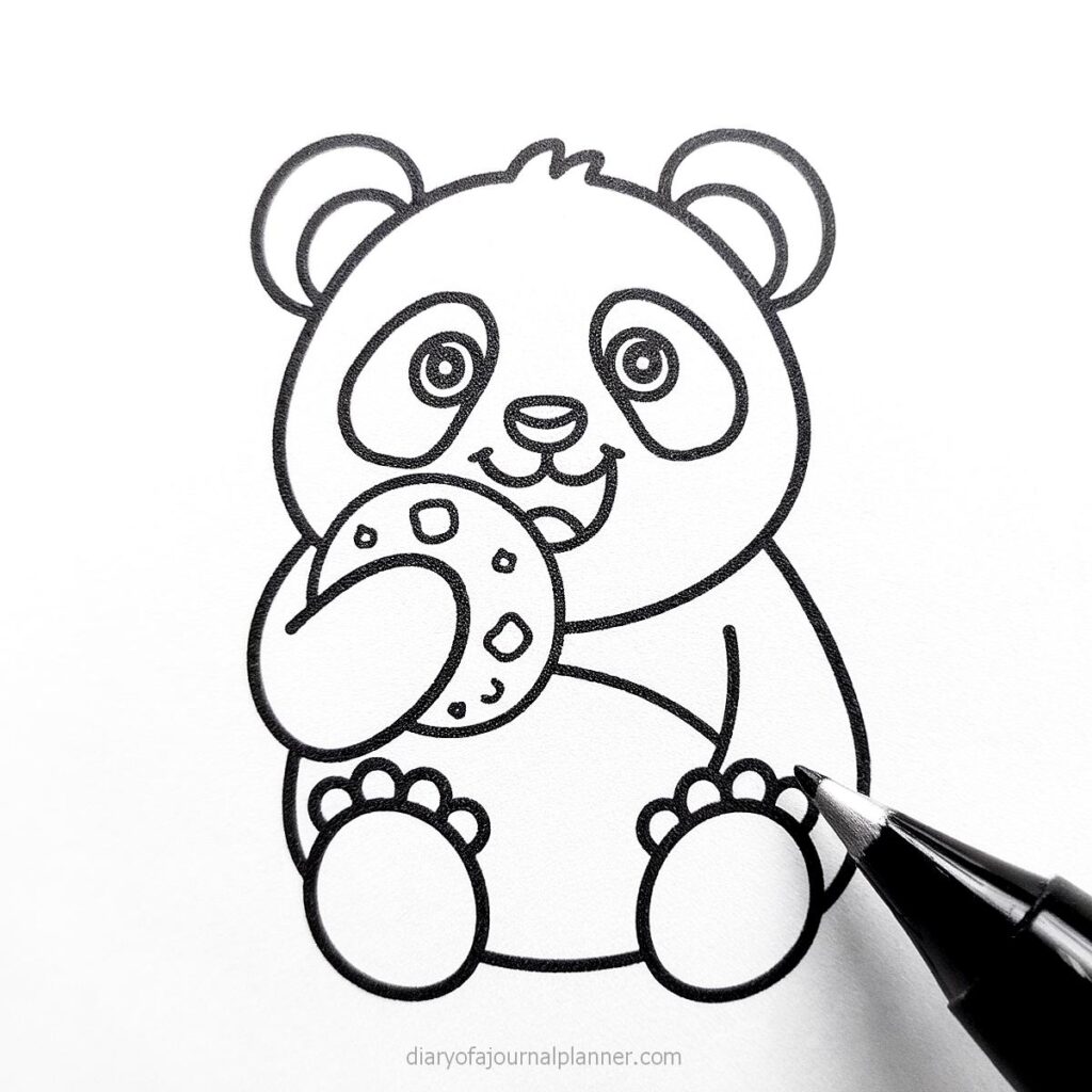 Cute panda holding a cookie drawing in progress with black pen on white paper. Perfect for coloring pages.