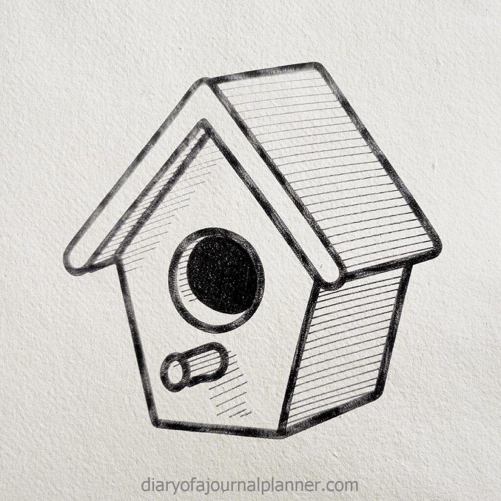 Hand-drawn birdhouse sketch on textured paper, featuring a simple triangular roof and circular entrance.