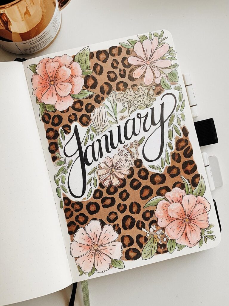 Decorative January bullet journal with leopard print and floral designs.
