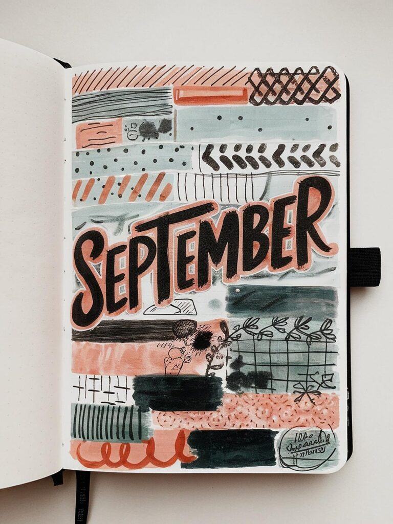 Decorative bullet journal page for September with abstract designs and text.