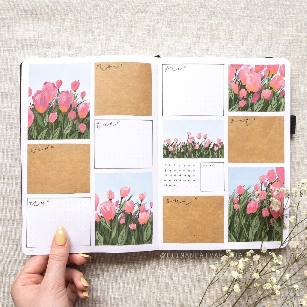 Bullet journal weekly spread with hand-painted pink tulips and handwritten notes on a textured background.