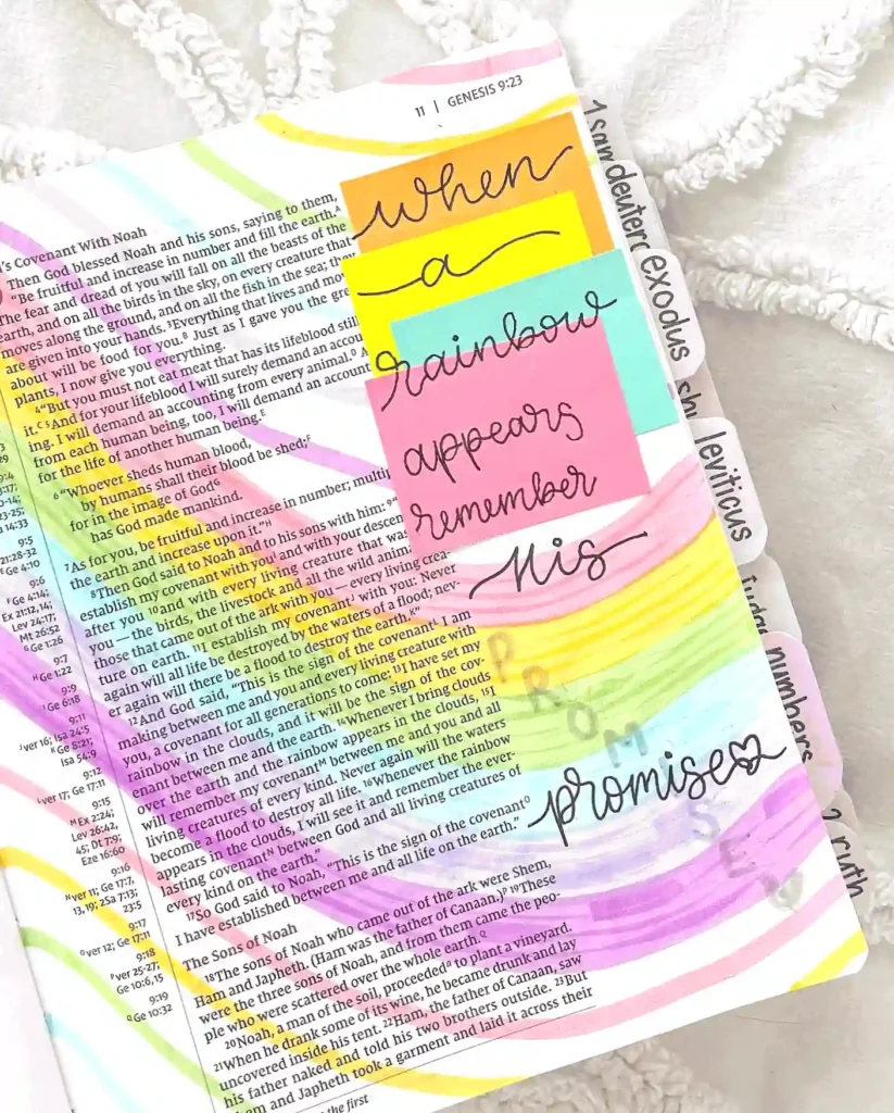 Bible page with rainbow colors and a note saying, When a rainbow appears, remember His promise.