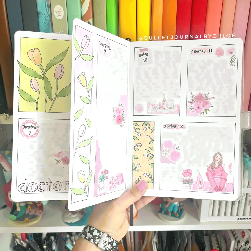 Open bullet journal with floral designs and pastel colors, showing a weekly planner layout for artistic organization.