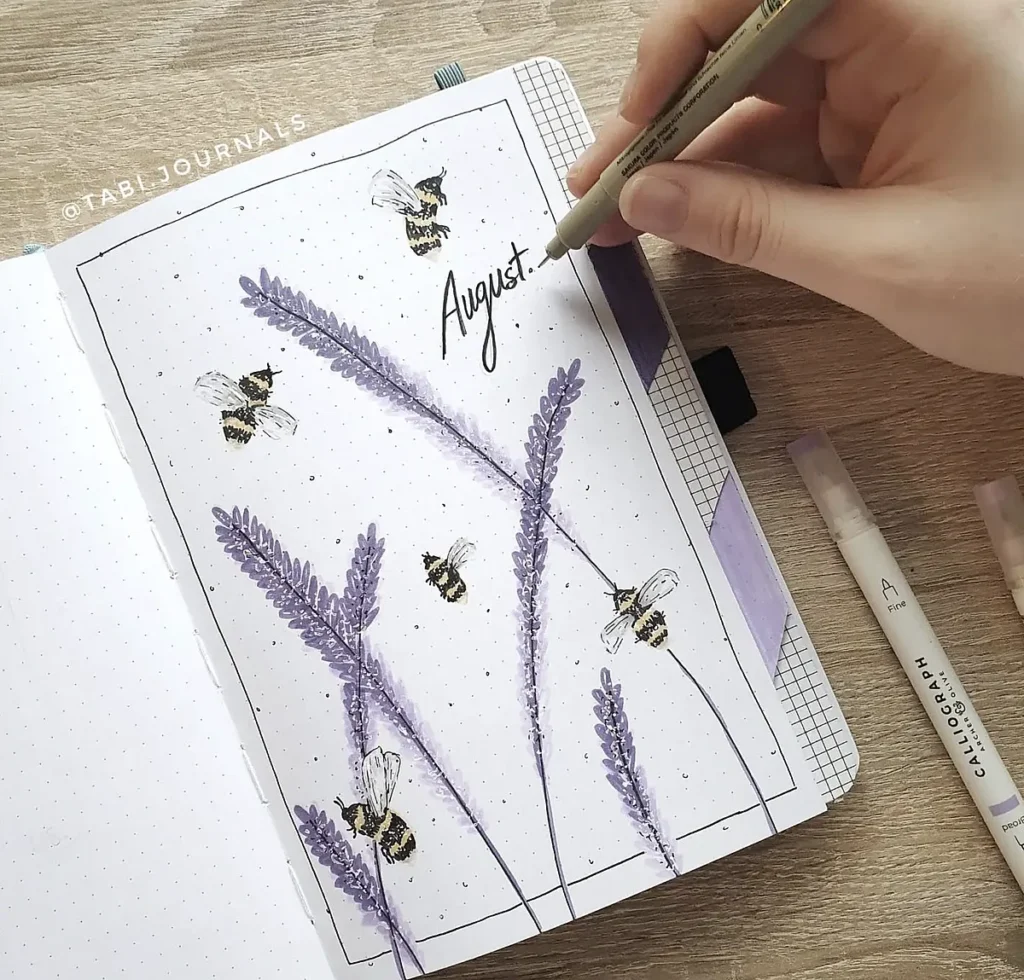 Hand drawing August with bees and lavender on a bullet journal page.