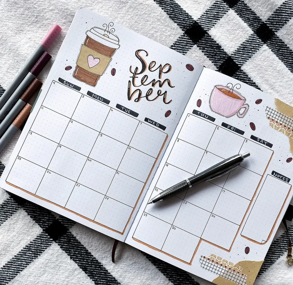 September bullet journal layout with calendar, coffee illustrations, and pen on a checkered background.