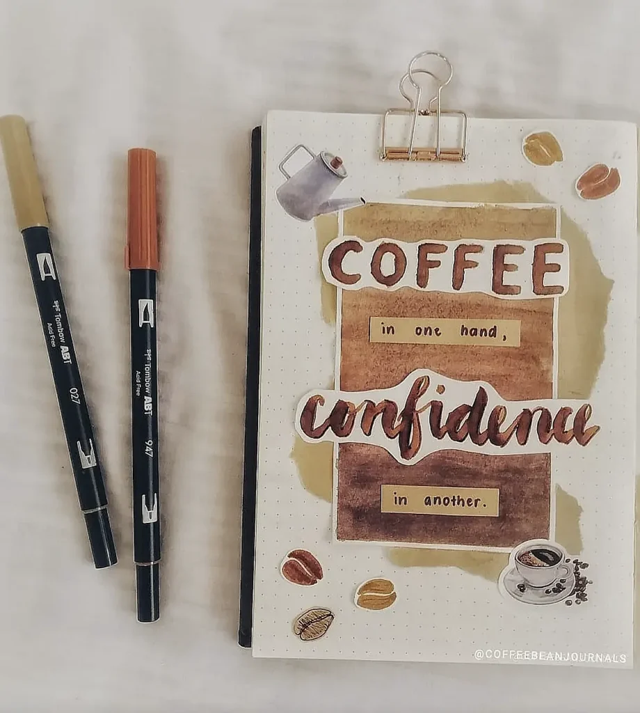 Notebook with Coffee in one hand, confidence in another design, next to two markers on a dotted page.