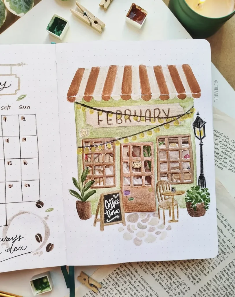 Bullet journal February cover with cute coffee shop illustration, plants, and calendar details. Cozy and artistic theme.