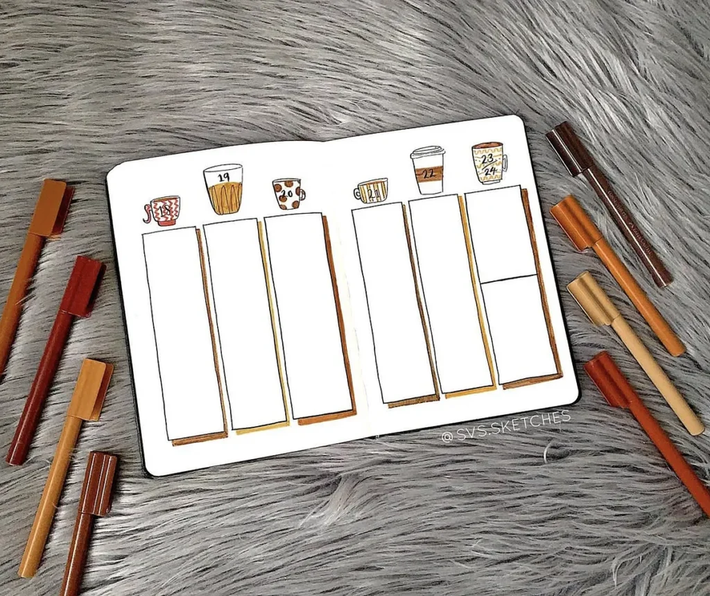 Bullet journal weekly layout with cup doodles, surrounded by brown pens on a fluffy gray surface.