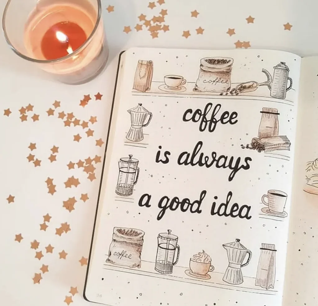 Open notebook with coffee is always a good idea text and coffee illustrations, with a lit candle nearby.