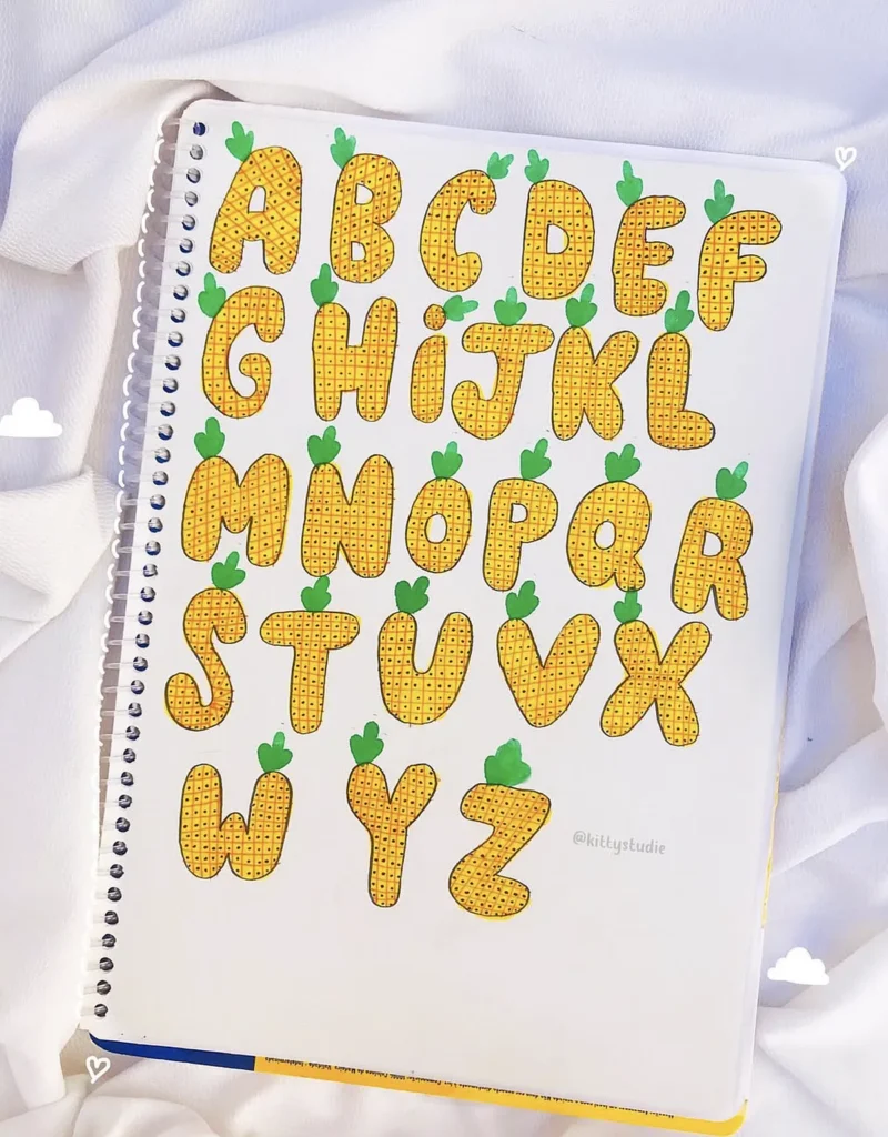 Alphabet letters styled as pineapples on a notebook page, with a playful and colorful design.