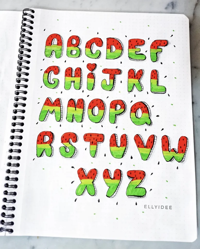 Watermelon-themed alphabet letters in a spiral notebook, featuring colorful Red and green design with black seeds.