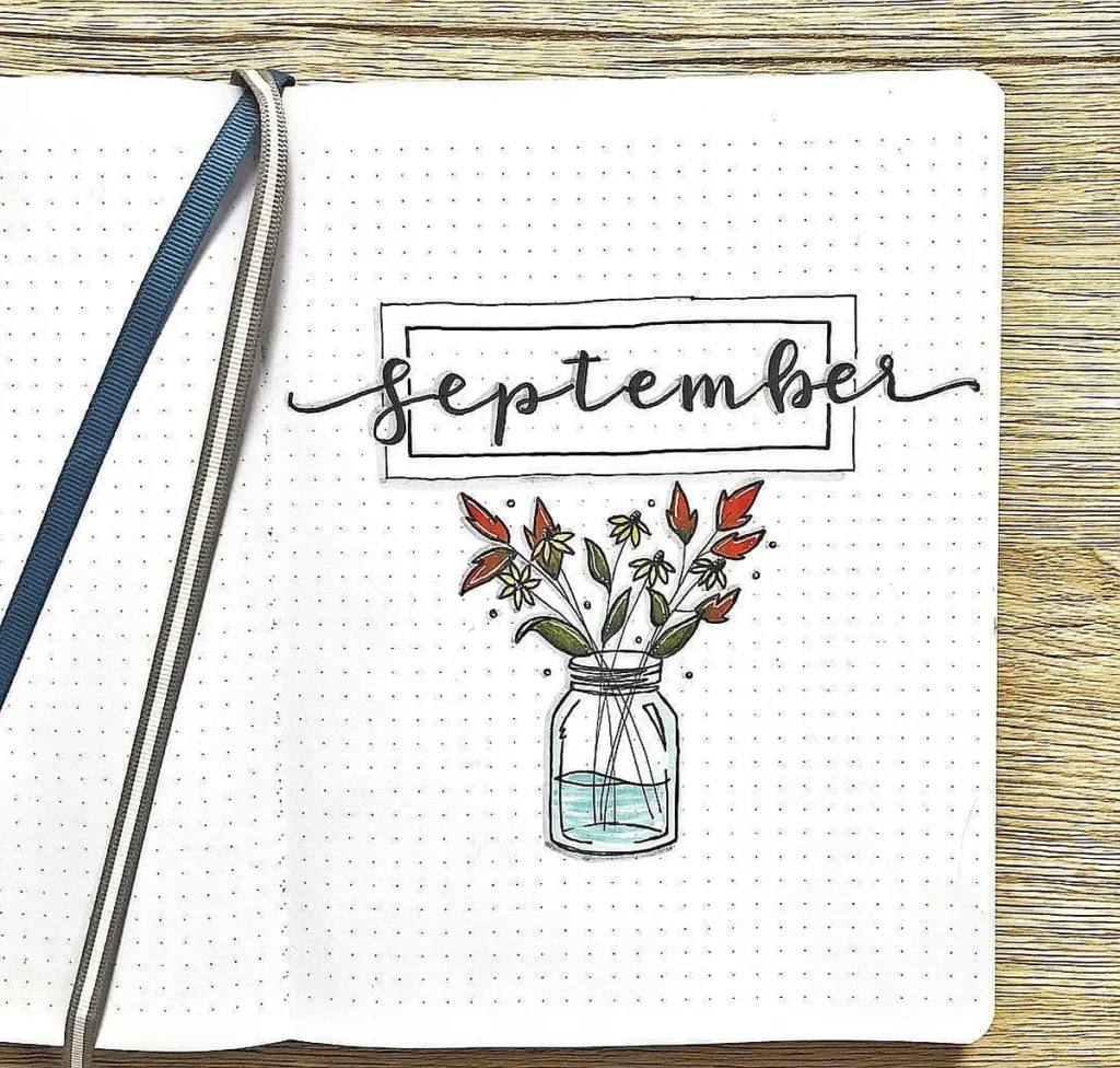 Bullet journal page for September with hand-drawn flowers in a jar.