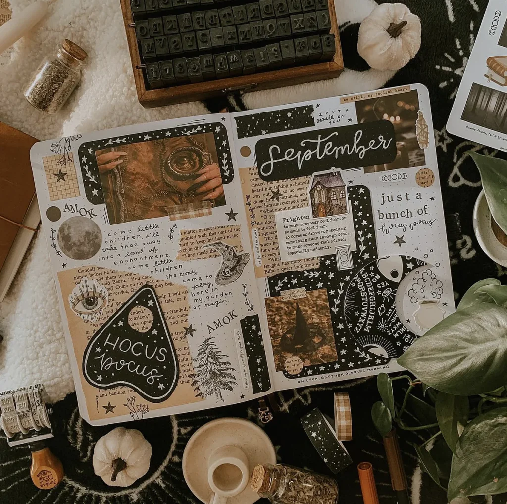 Creative September journal spread with fall-themed decorations and vintage elements, surrounded by cozy autumn items.