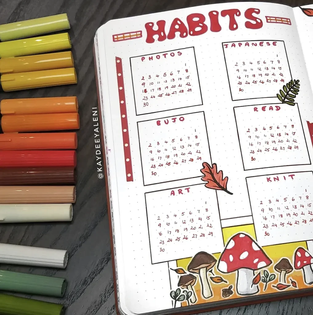 Colorful habit tracker journal with mushrooms, featuring sections for photos, Japanese, reading, art, and knitting.