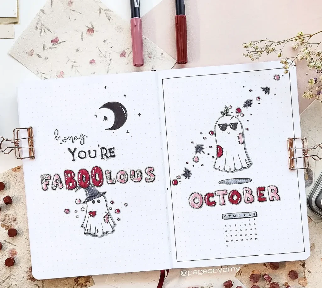October bullet journal with ghost theme, handwritten text: You're Faboolous, floral accents.