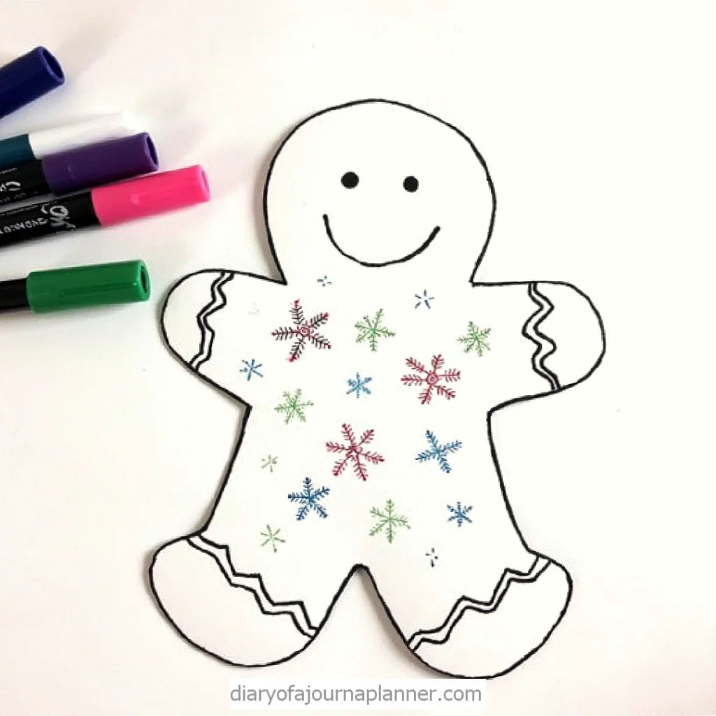 Smiling gingerbread man design with colorful snowflakes and markers. Perfect for holiday crafts and decoration ideas.