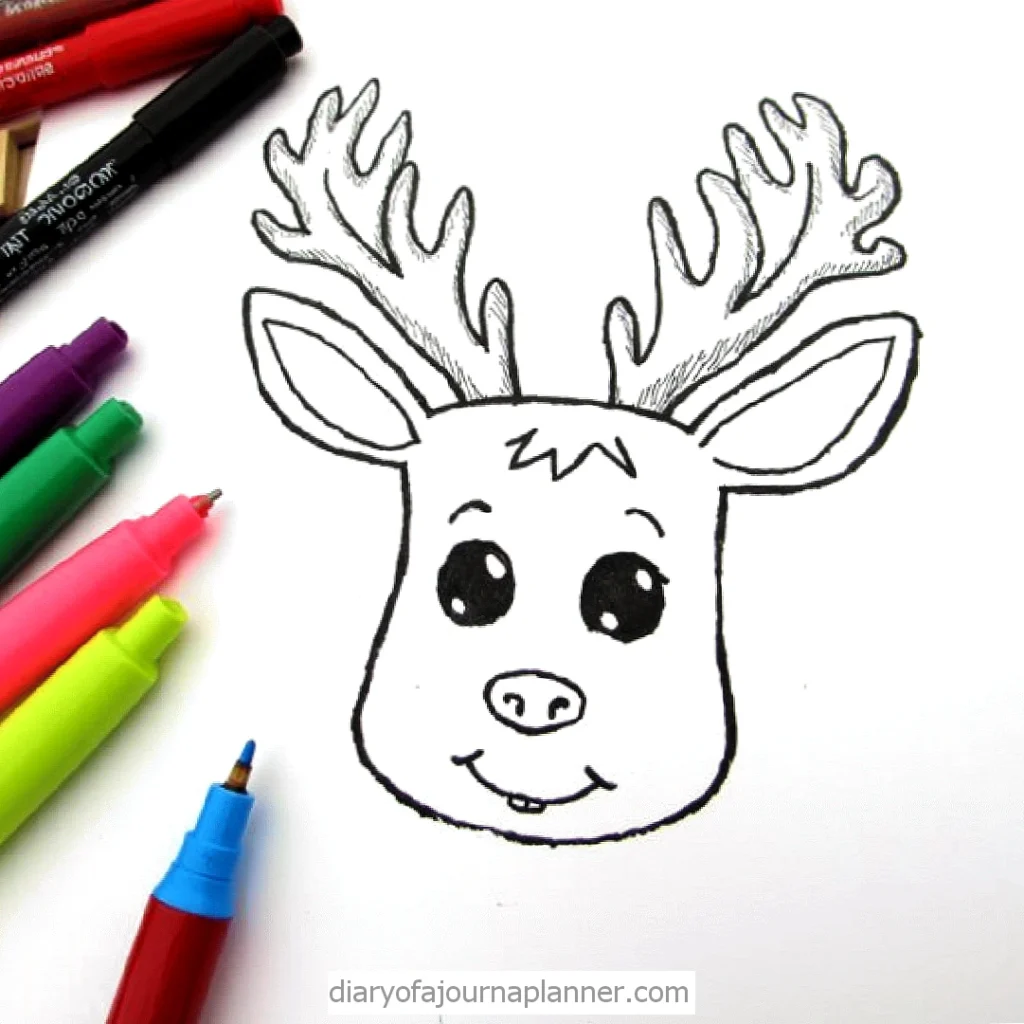 Cute reindeer drawing with colorful markers beside it, perfect for kids' holiday crafts and creativity.