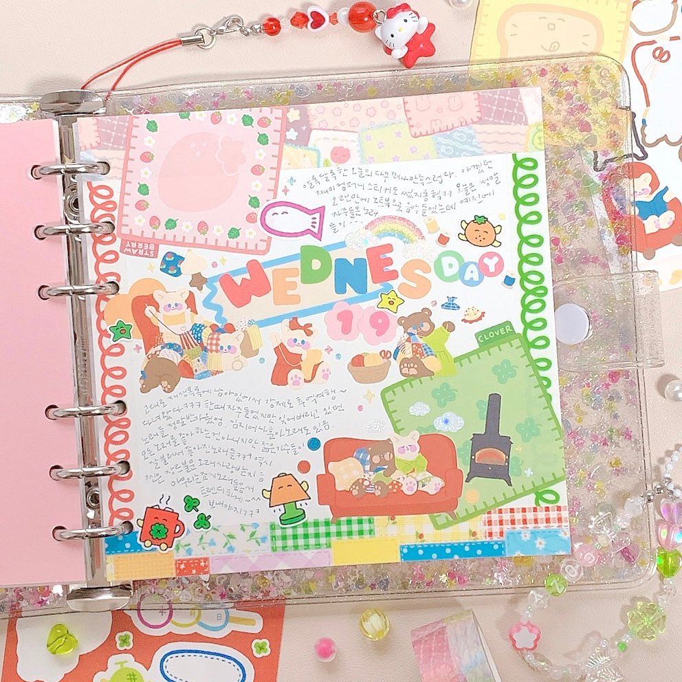 Colorful planner page with cute stickers and doodles celebrating Wednesday, featuring bears and bright decorations.