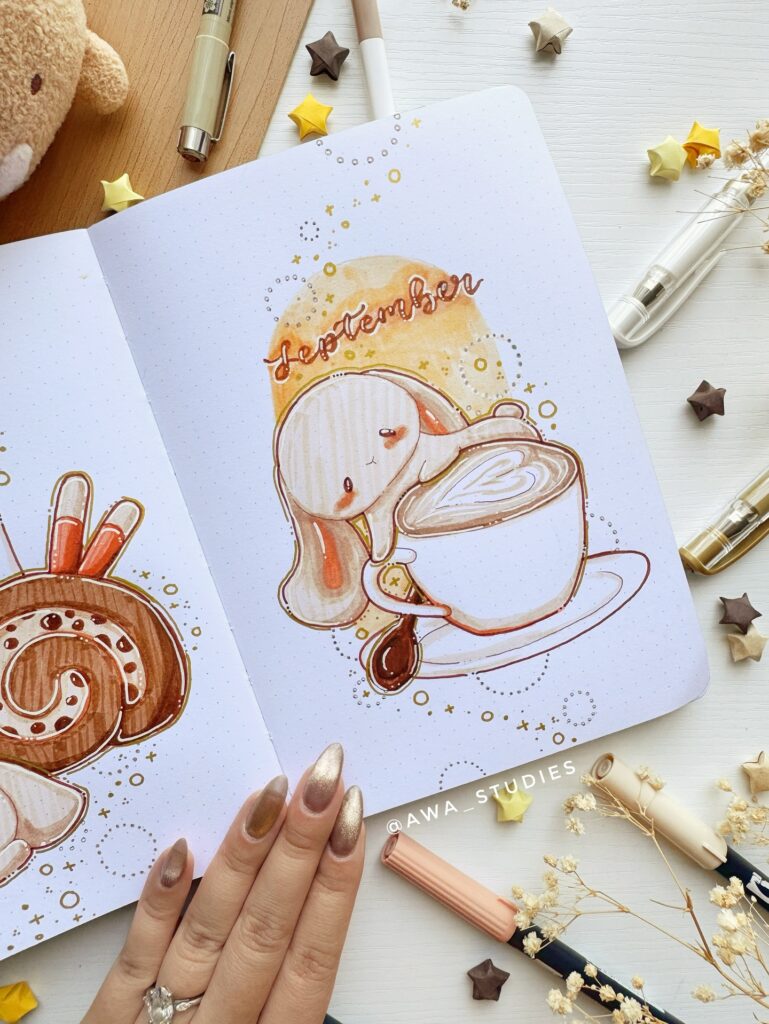 Cute September-themed journal art with coffee and pastries, surrounded by colorful stars and pens.