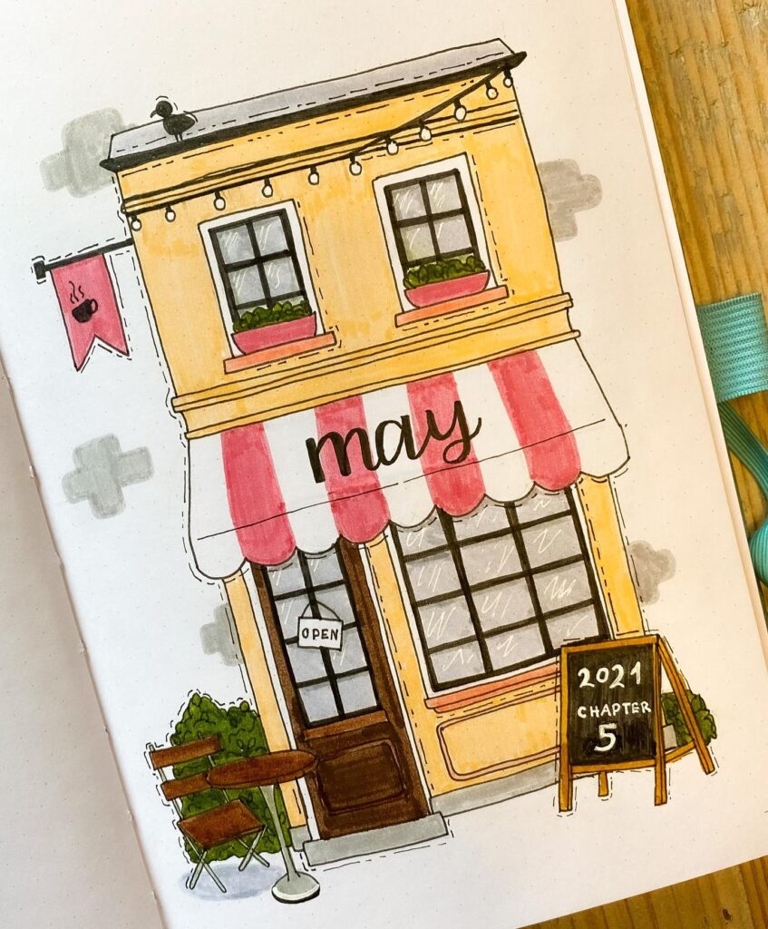 Illustration of a small café with a red and white awning, labeled May, and a chalkboard sign, open for business.