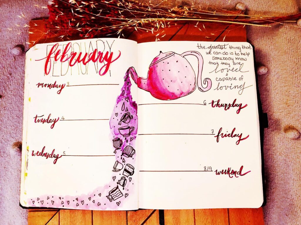 Creative February planner page with teapot art and motivational quote. Decorated for weekly organization and inspiration.