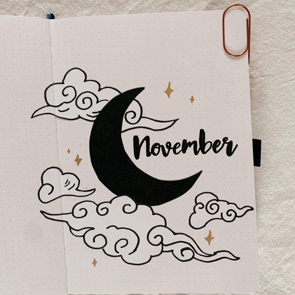 Bullet journal page for November featuring a crescent moon and clouds.