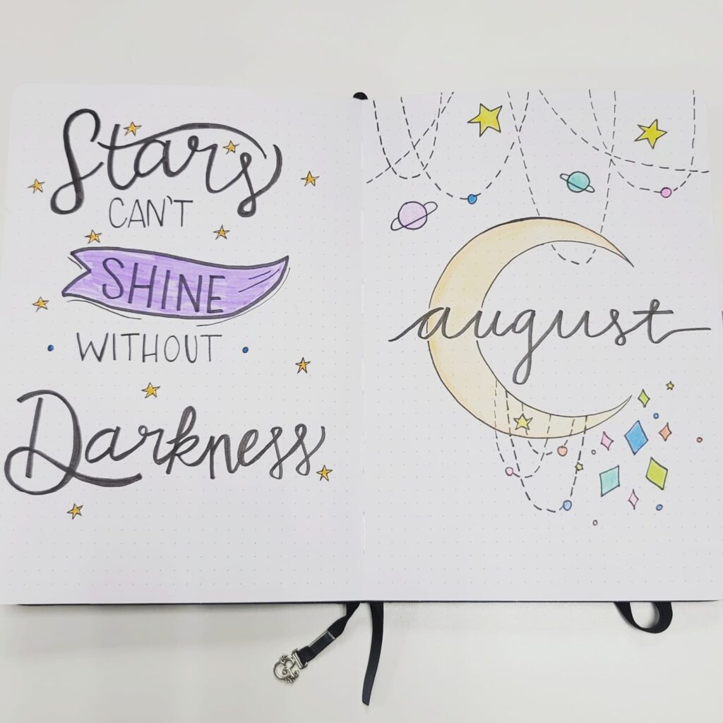 August journal page with Stars can't shine without darkness quote, crescent moon, stars, and planets.
