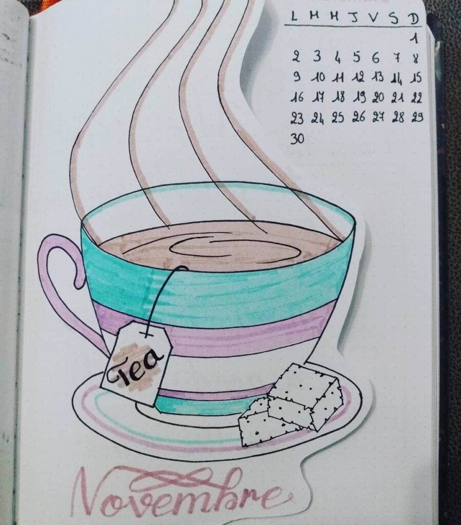 Hand-drawn teacup with steam and sugar cubes, November calendar page in the background. Cozy autumn vibes.
