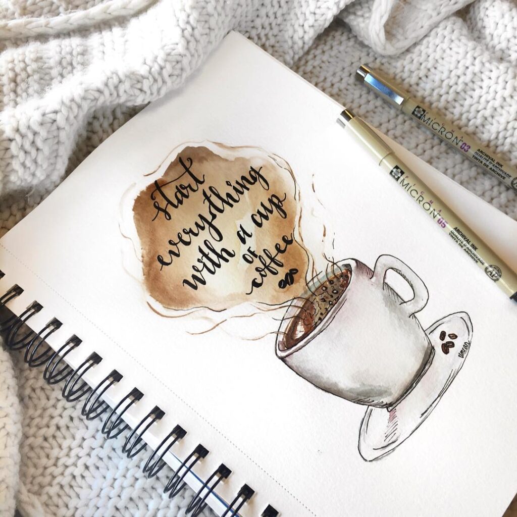 Illustrated quote: Start everything with a cup of coffee beside a steaming cup, pens, and cozy blanket.