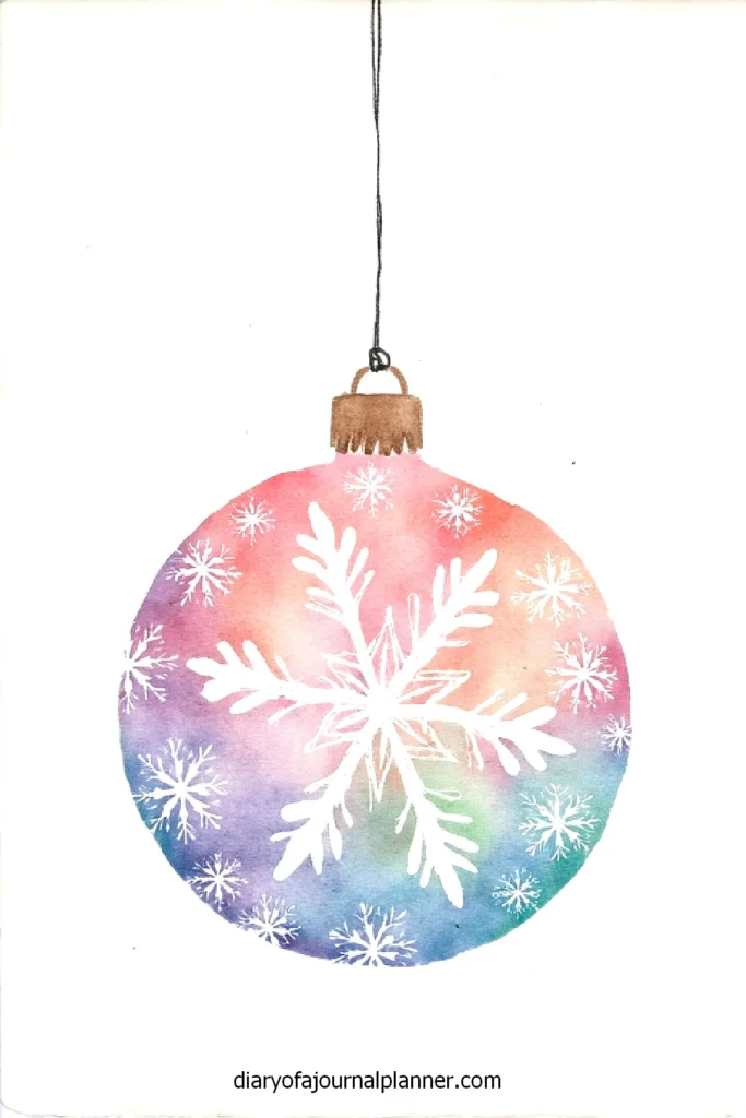 Colorful Christmas ornament with snowflake design, watercolor art on white background. Festive holiday decoration illustration.