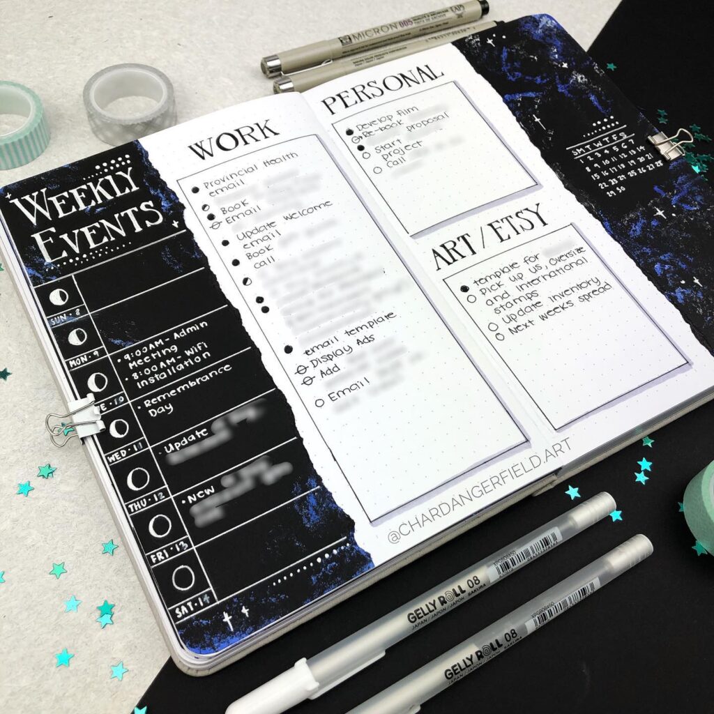 Bullet journal planner with sections for work, personal, and art tasks, open on a desk with pens and washi tape.