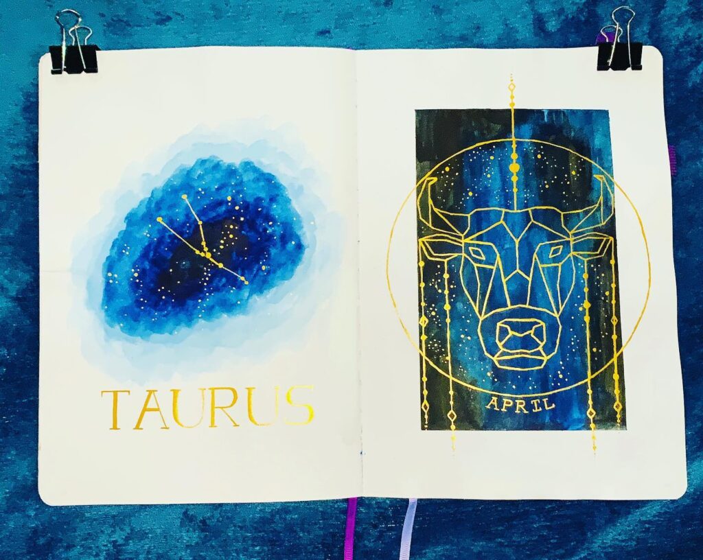 Artistic Taurus zodiac sign with constellation and bull illustration on blue background in a sketchbook.