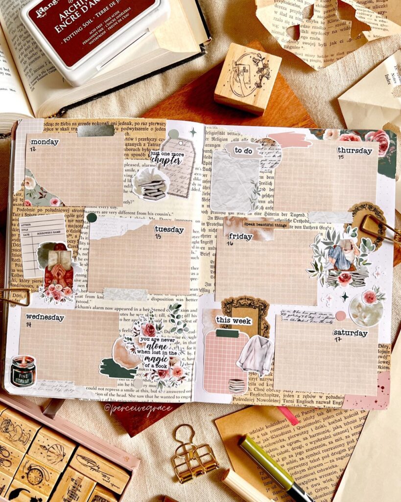 Aesthetic bullet journal spread with floral stickers, vintage stamps, and weekly planner on open book background.