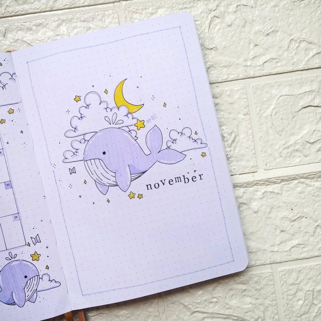 Cute purple whale illustration with clouds, stars, and a crescent moon for a November planner page.