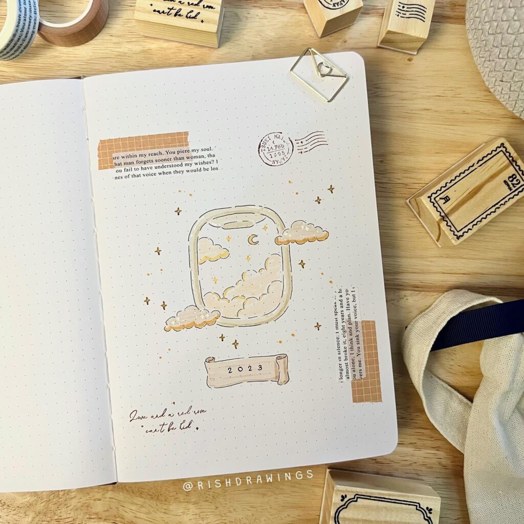 Artistic journal page with a dreamy cloud and window illustration, featuring the year 2023 in soft neutral tones.