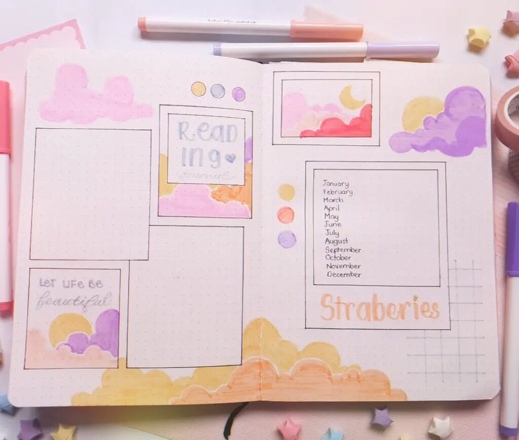 Colorful bullet journal layout with pastel clouds, month list, and reading section for creative inspiration.