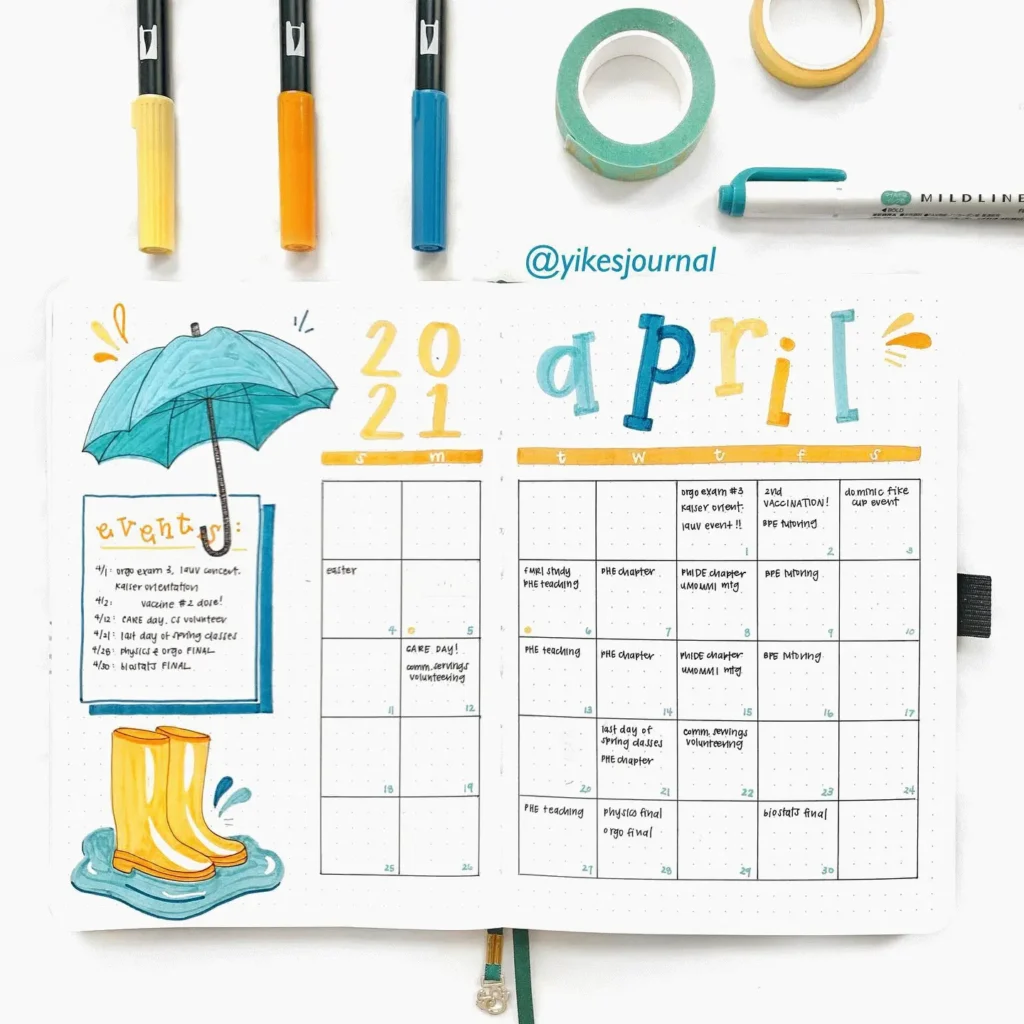 April 2021 bullet journal spread with colorful calendar, events, umbrella illustration, and stationery tools.