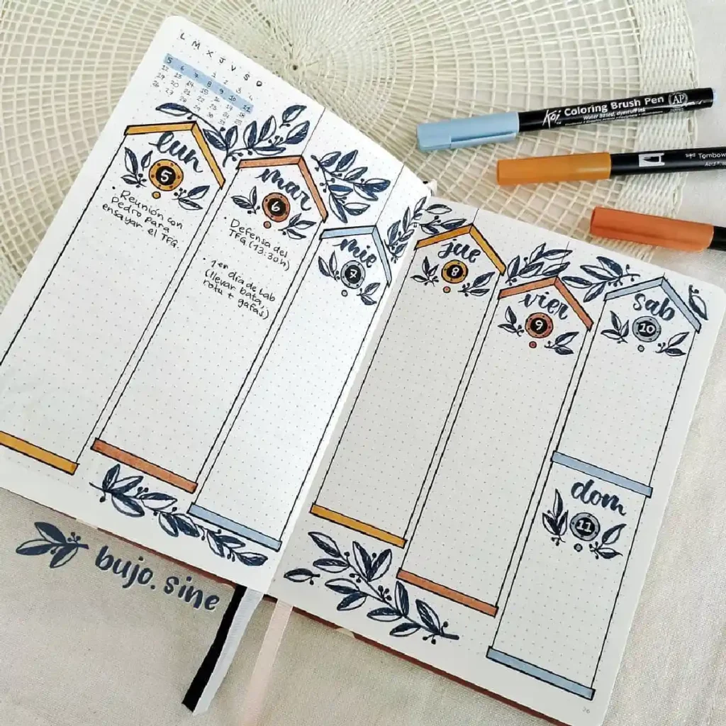 A beautifully designed bullet journal weekly spread with decorative elements for task organization.
