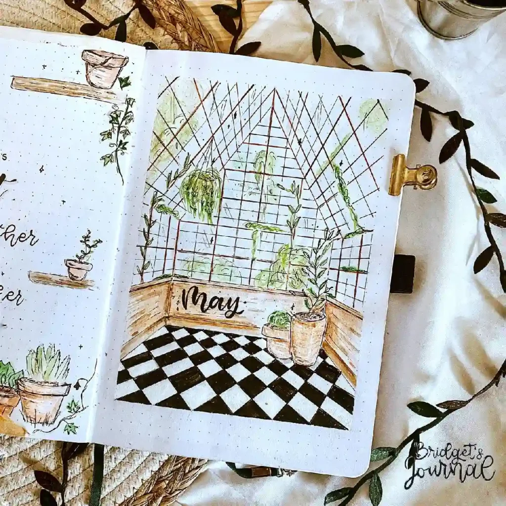 Bullet journal spread for May, featuring a hand-drawn greenhouse with plants, a checkerboard floor, and decorative elements.