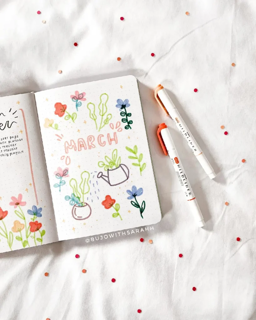 Colorful bullet journal spread for March featuring flowers and a watering can on a white background with confetti.