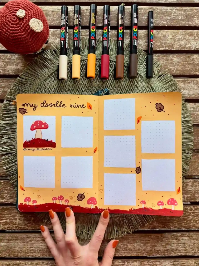 Colorful doodle journal layout with markers, featuring a whimsical mushroom design and blank sections for creativity.