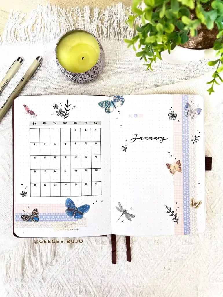 Aesthetic bullet journal page for January featuring a calendar, butterflies, and a candle on a textured background.