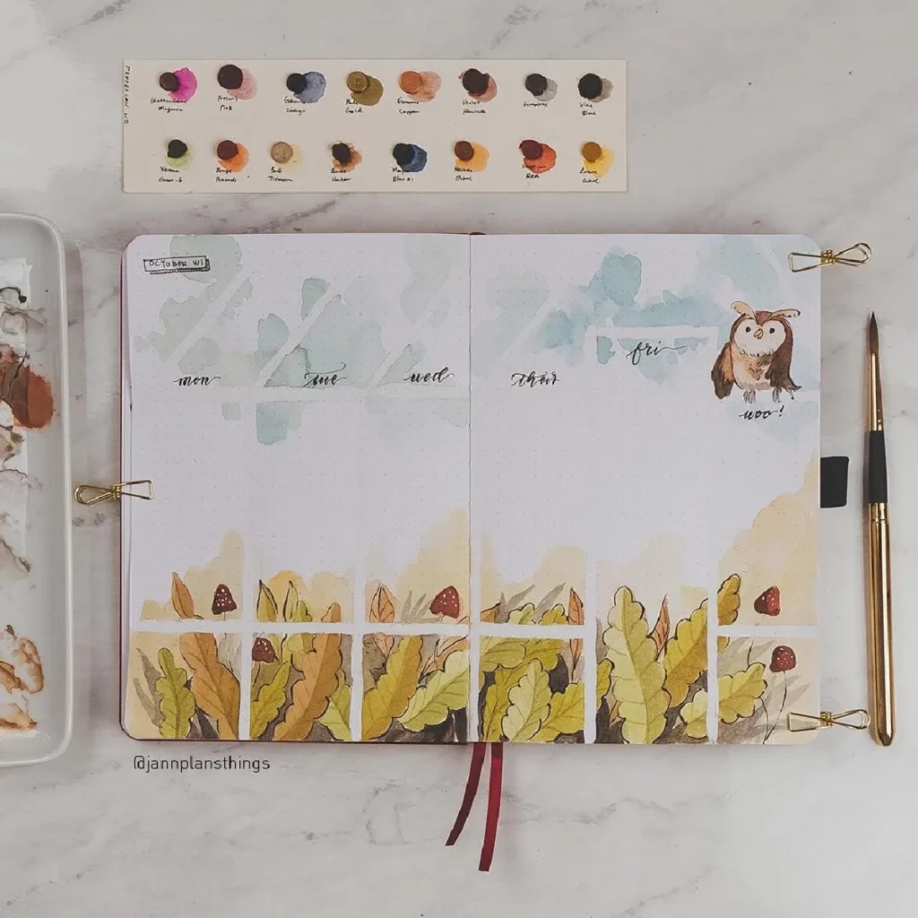 Colorful bullet journal spread with autumn leaves, an owl illustration, and watercolor palette, inviting weekly planning.