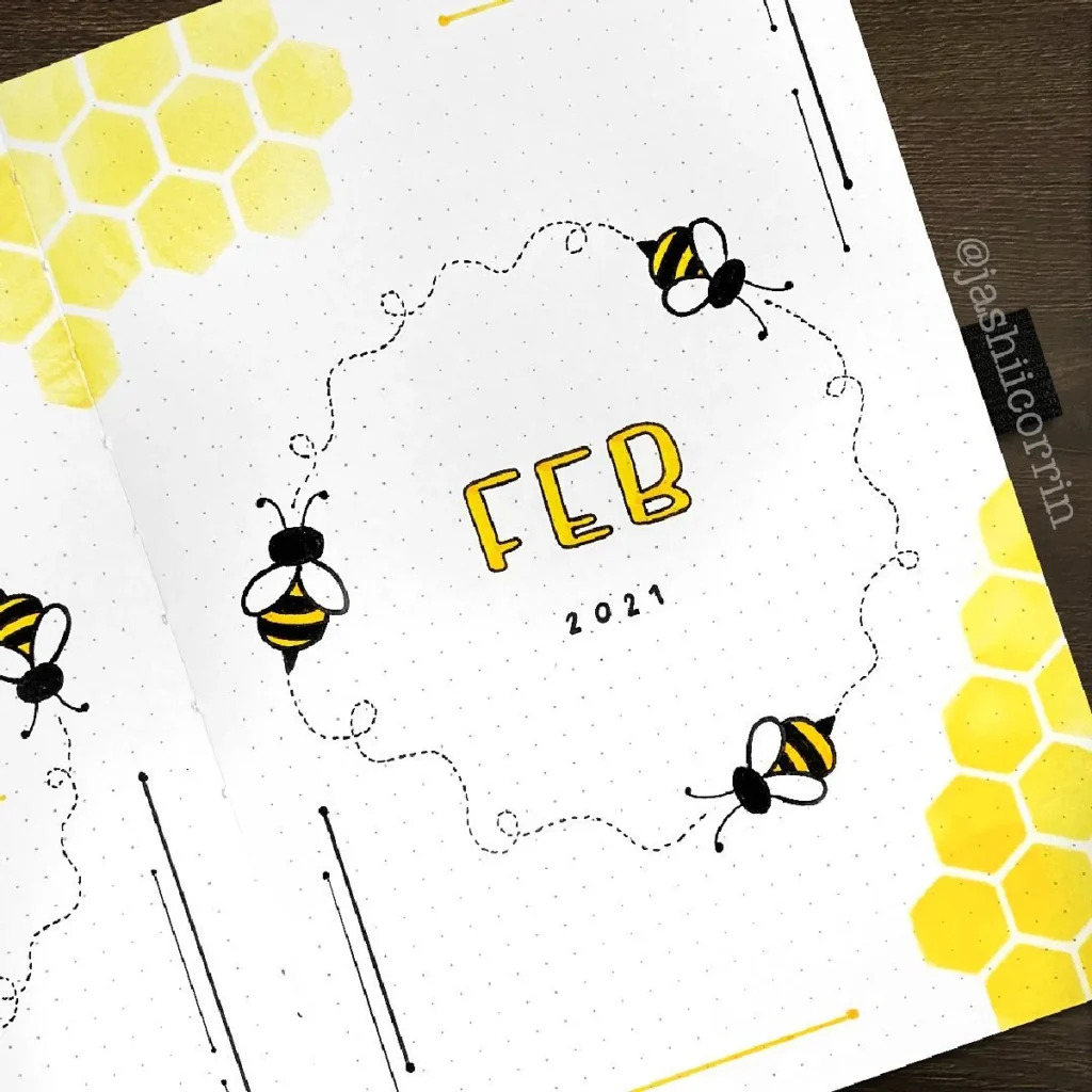 Bullet journal layout for February 2021 featuring bees and honeycomb designs in yellow and black.