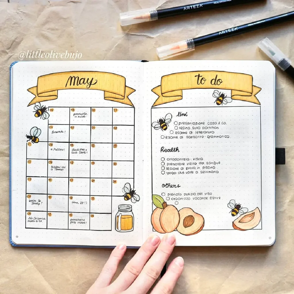 Bullet journal layout for May, featuring a calendar, to-do list, and artistic honeybee illustrations.