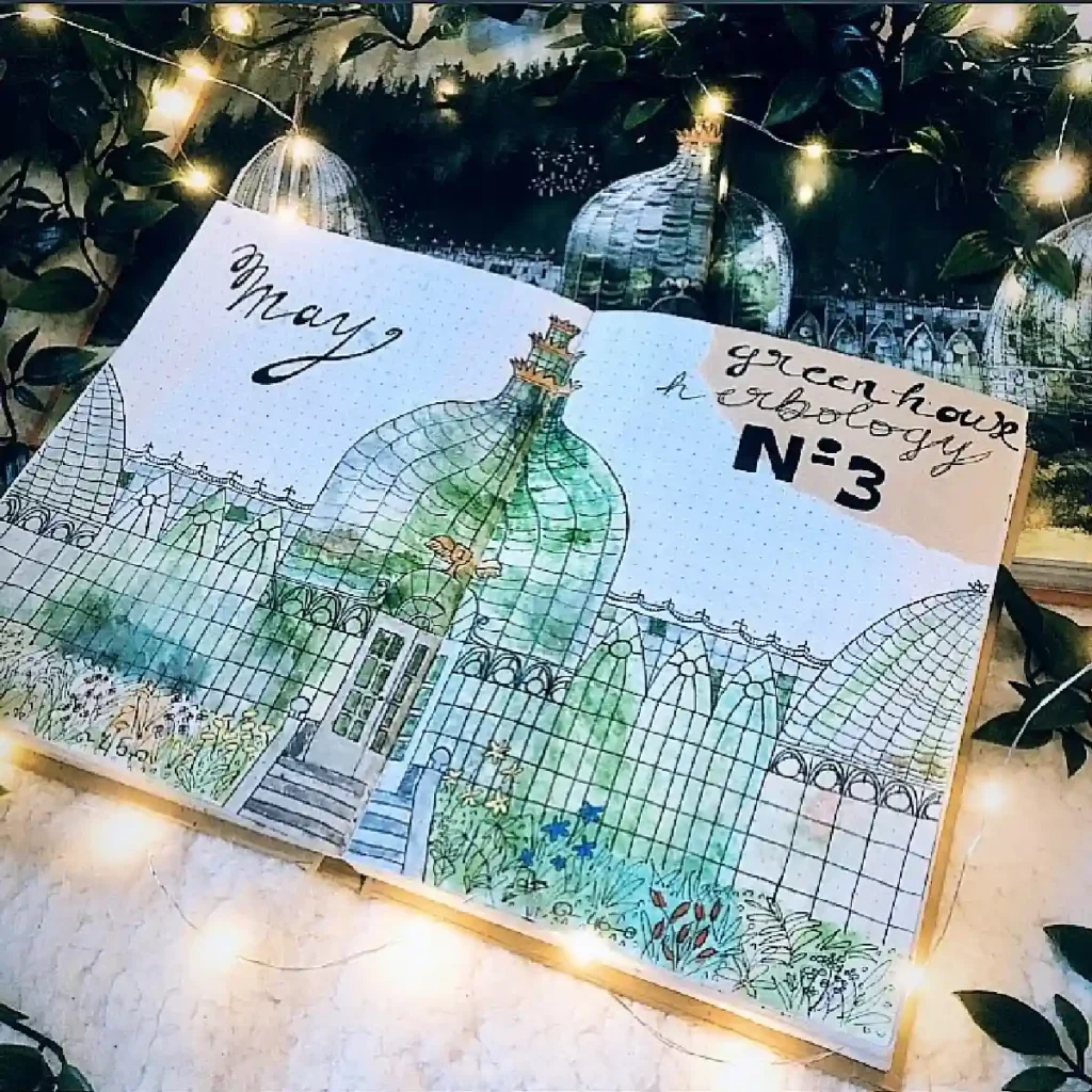 A beautifully illustrated bullet journal page featuring a greenhouse theme for May, surrounded by twinkling lights.